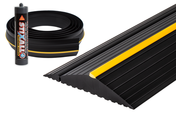 Weather Defender XL Garage Door Seal Kit with black floor threshold seal and Sika adhesive for weatherproof garage door sealing.